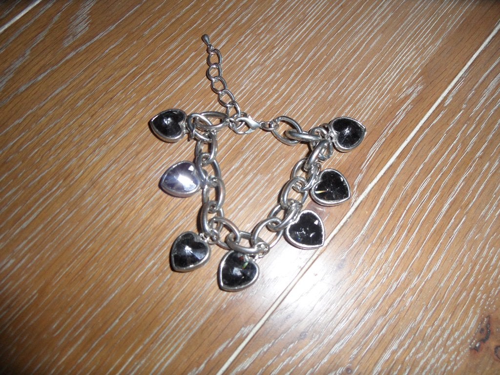 Schakelarmband met 7 blinkende glazen hartjes, Overige materialen, Gebruikt, Ophalen of Verzenden, Met bedels of kralen