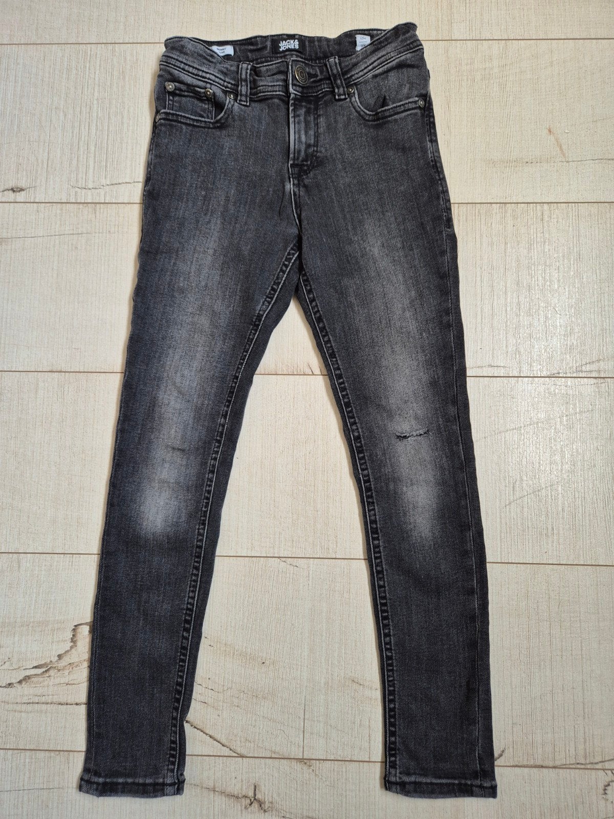 grijs/ zwarte Skinny Liam jeans mt 134 (Jack & Jones), Gebruikt, Ophalen, Broek, Jongen