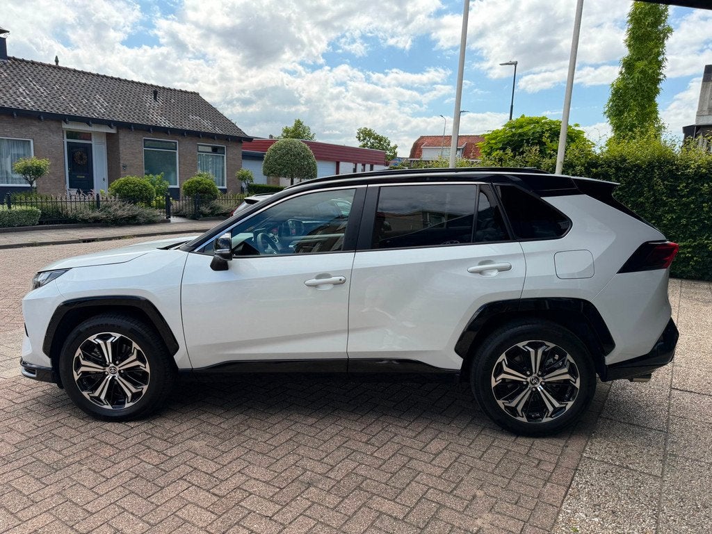 Toyota RAV4 2.5 Plug-in Hybrid AWD Bi-Tone Plus|Pano|Stoel V, Auto's, Toyota, Automaat, Gebruikt, 4 cilinders, Wit