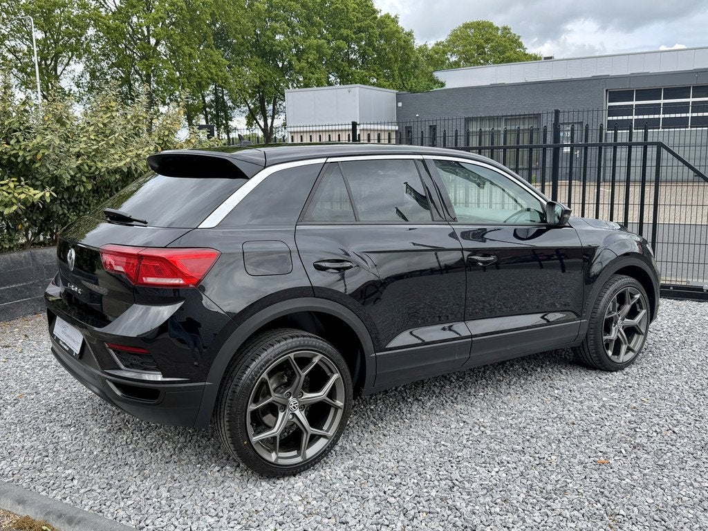 Volkswagen T-Roc 1.0 TSI Style Navi|Media|PDC|Lineast Zwart, Voorwielaandrijving, Stof, Gebruikt, Met garantie (alle)