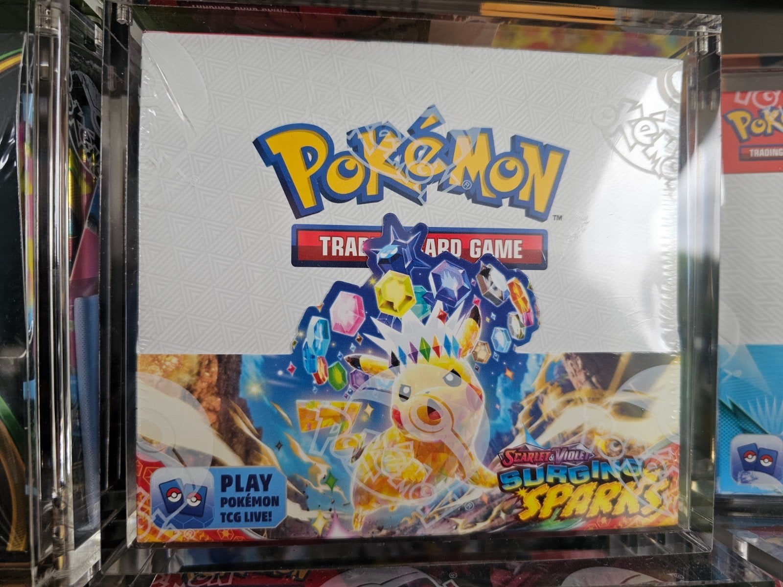 Pokémon Boosterbox -  Surging Sparks - €290,-, Ophalen of Verzenden