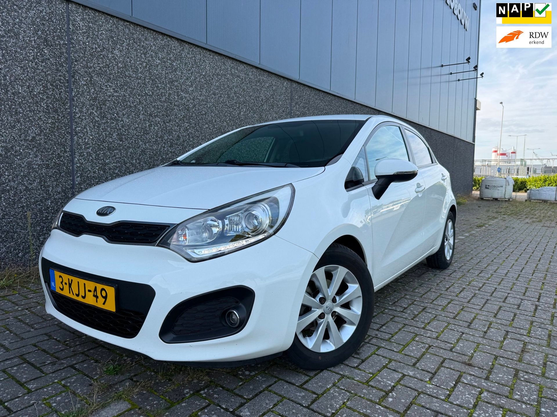 Kia Rio 1.2 CVVT Super Pack/Cruise/Clima/PDC/, Euro 5, Zwart, 4 cilinders, Wit