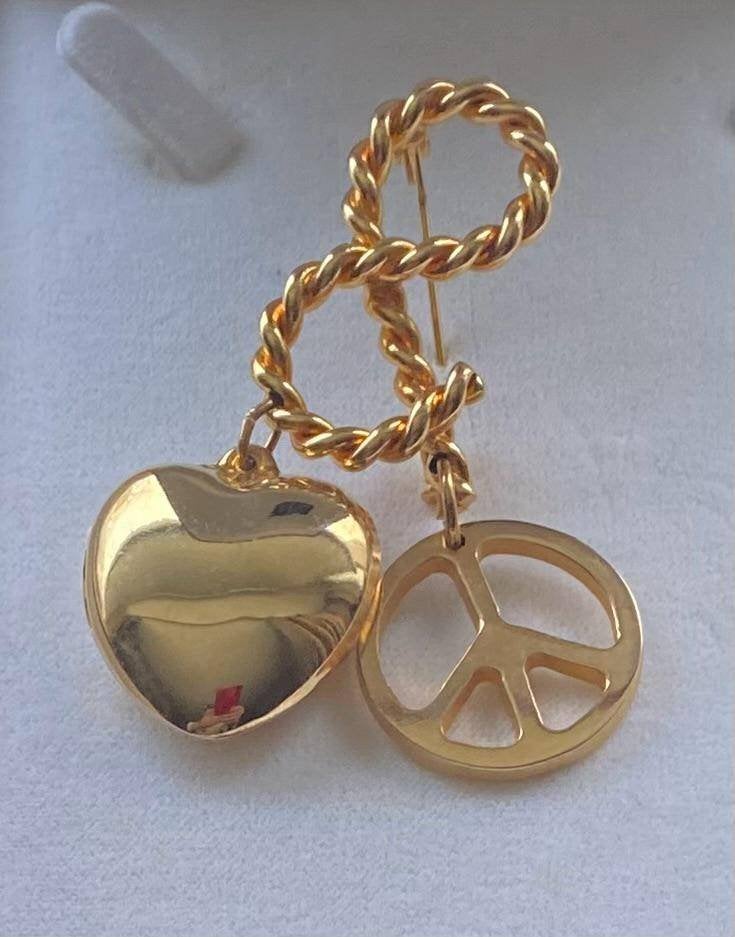 vintage broche Moschino, Ophalen of Verzenden, Gebruikt, Goud, Overige materialen