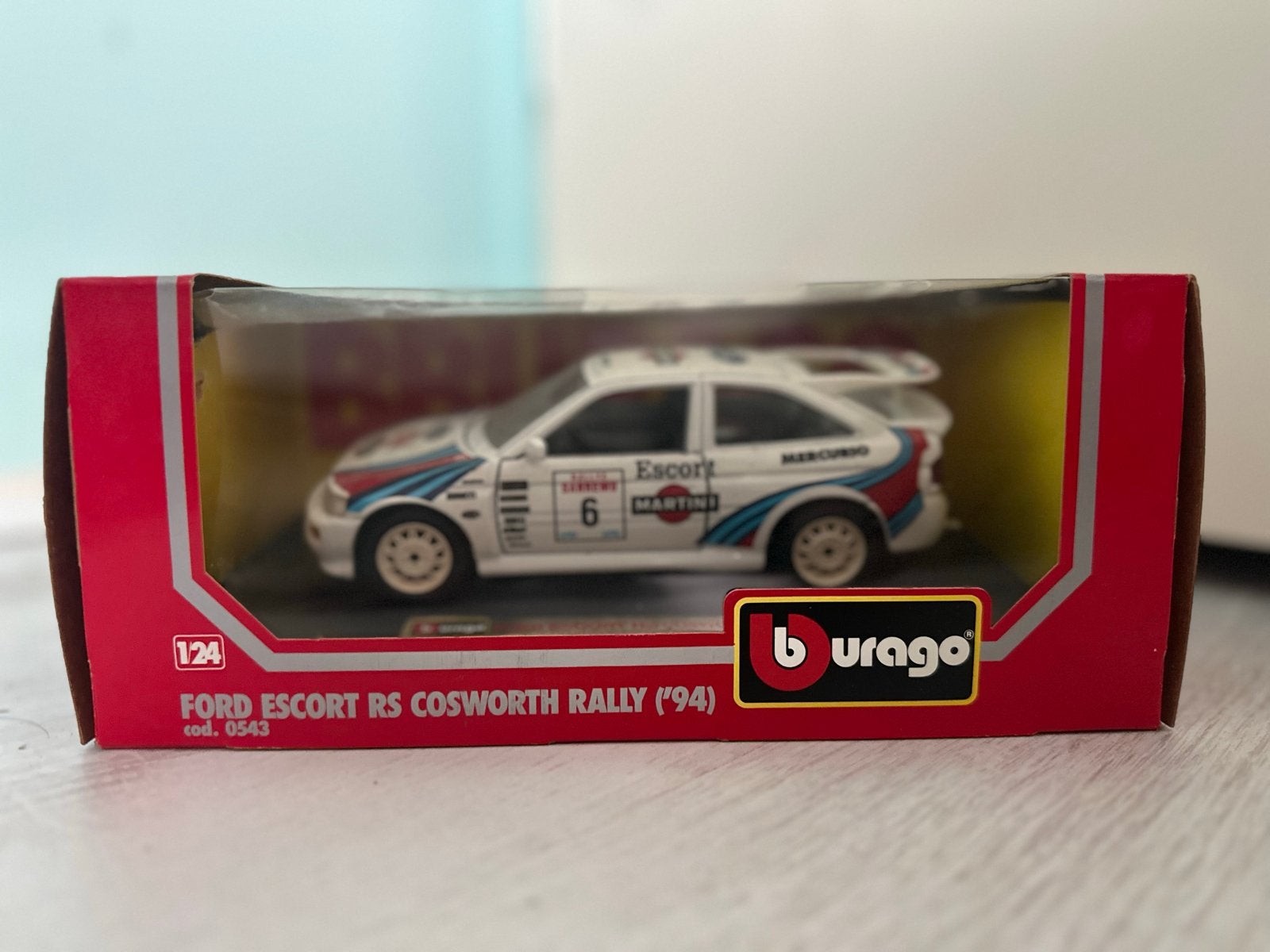 Burago Ford Escort RS Cosworth Rally '94  1:24, Ophalen of Verzenden, Zo goed als nieuw, Auto, Overige merken