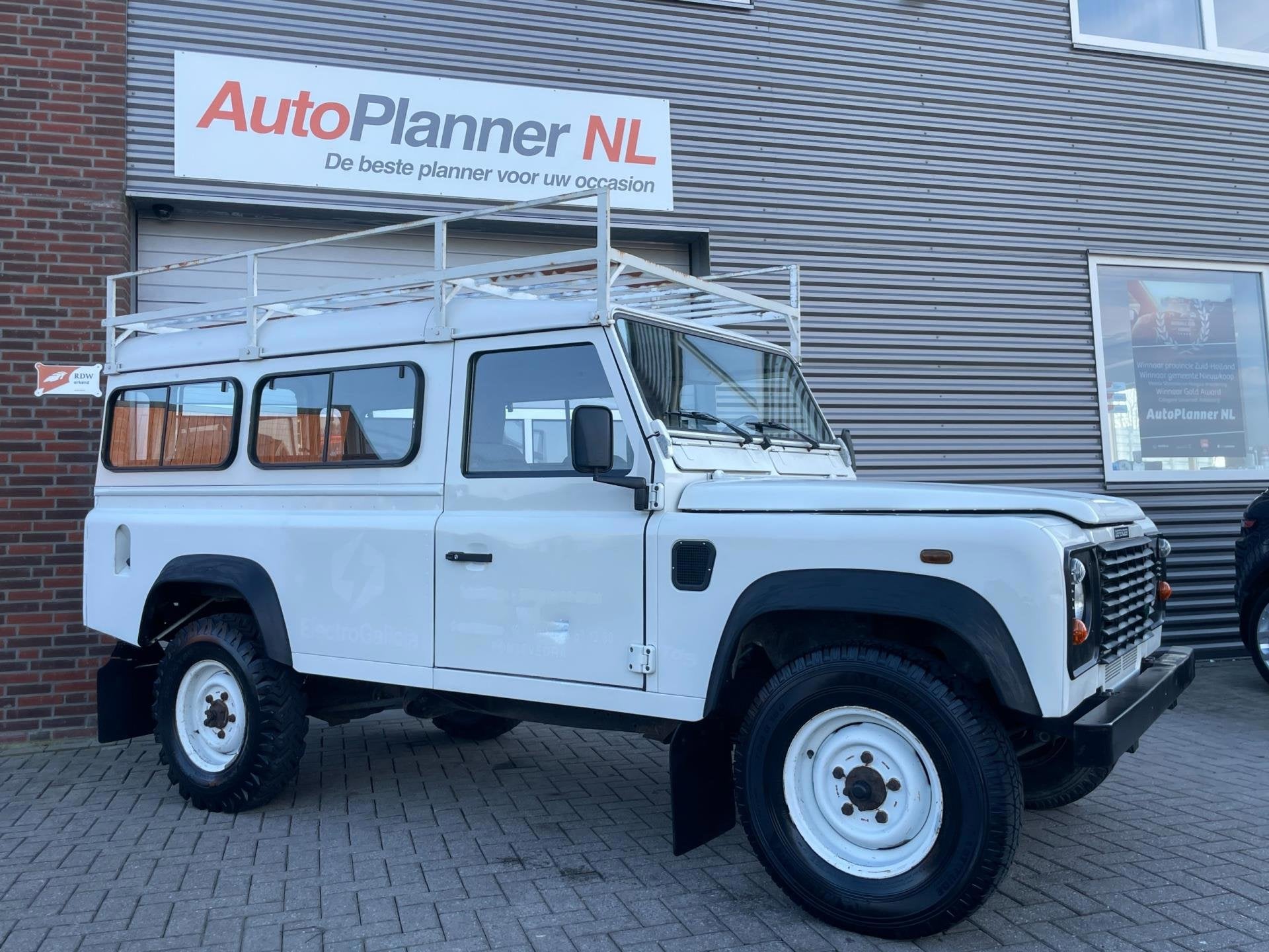 Land Rover Defender 2.5 Td5 110" County! 9-Persoons!, Auto's, Stof, Origineel Nederlands, 2402 cc, SUV of Terreinwagen