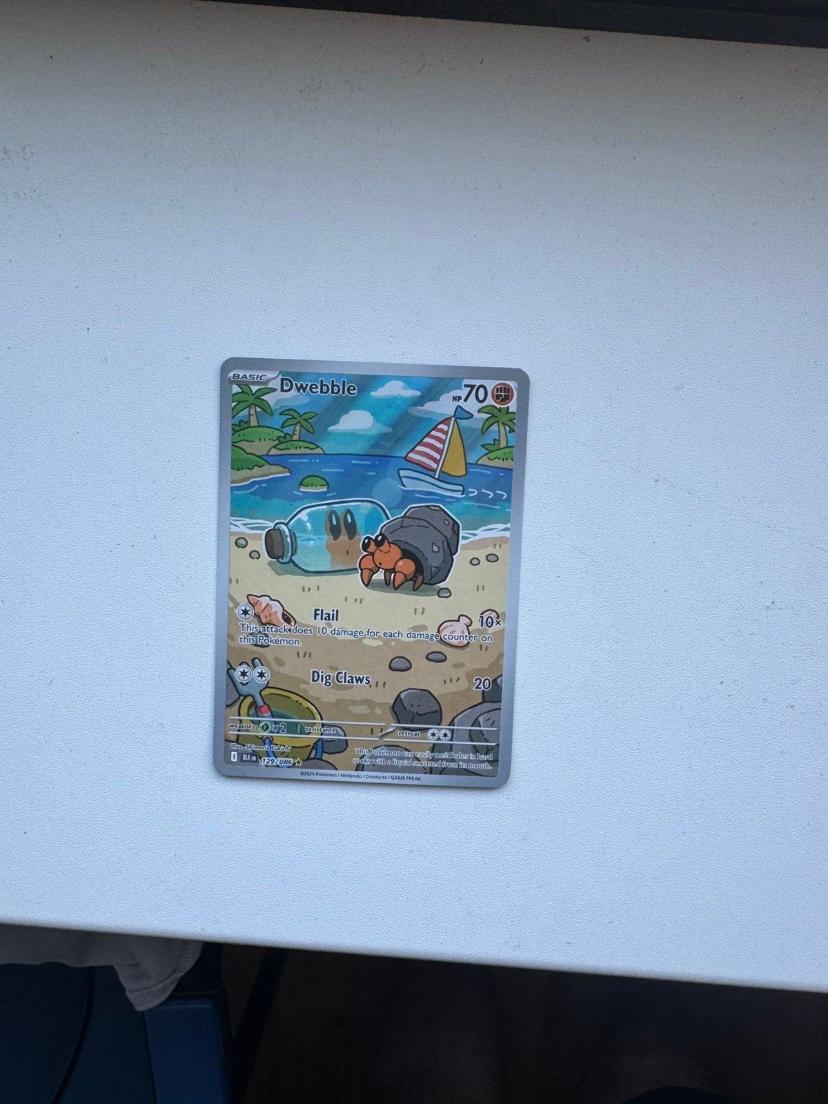 Pokémon Dwebble BLK 129/086, Ophalen of Verzenden, Zo goed als nieuw, Losse kaart