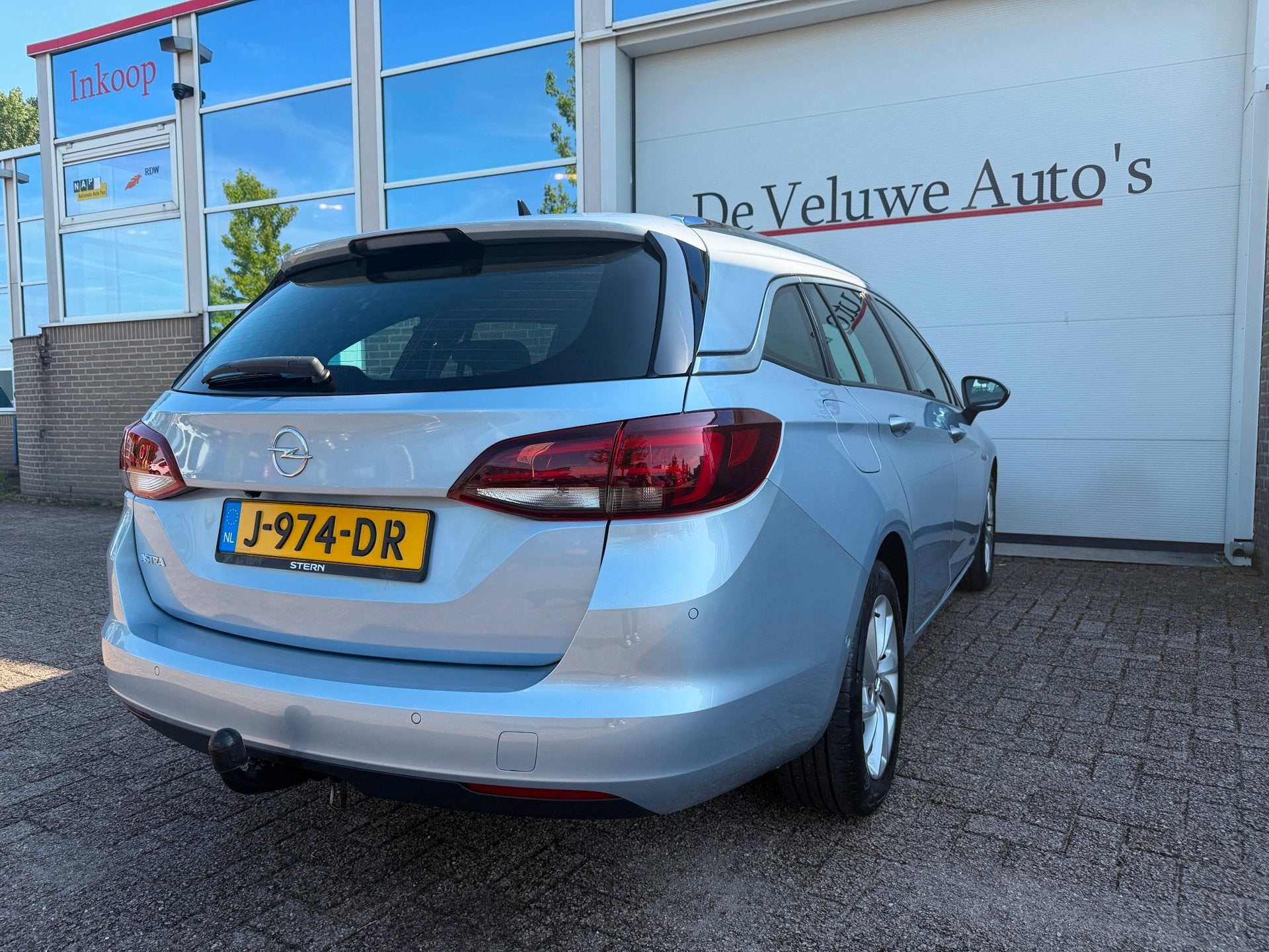 Opel Astra Sports Tourer 1.2 Elegance|PDC|Camera|Trekhaak, Voorwielaandrijving, Stof, 1199 cc, 23 km/l