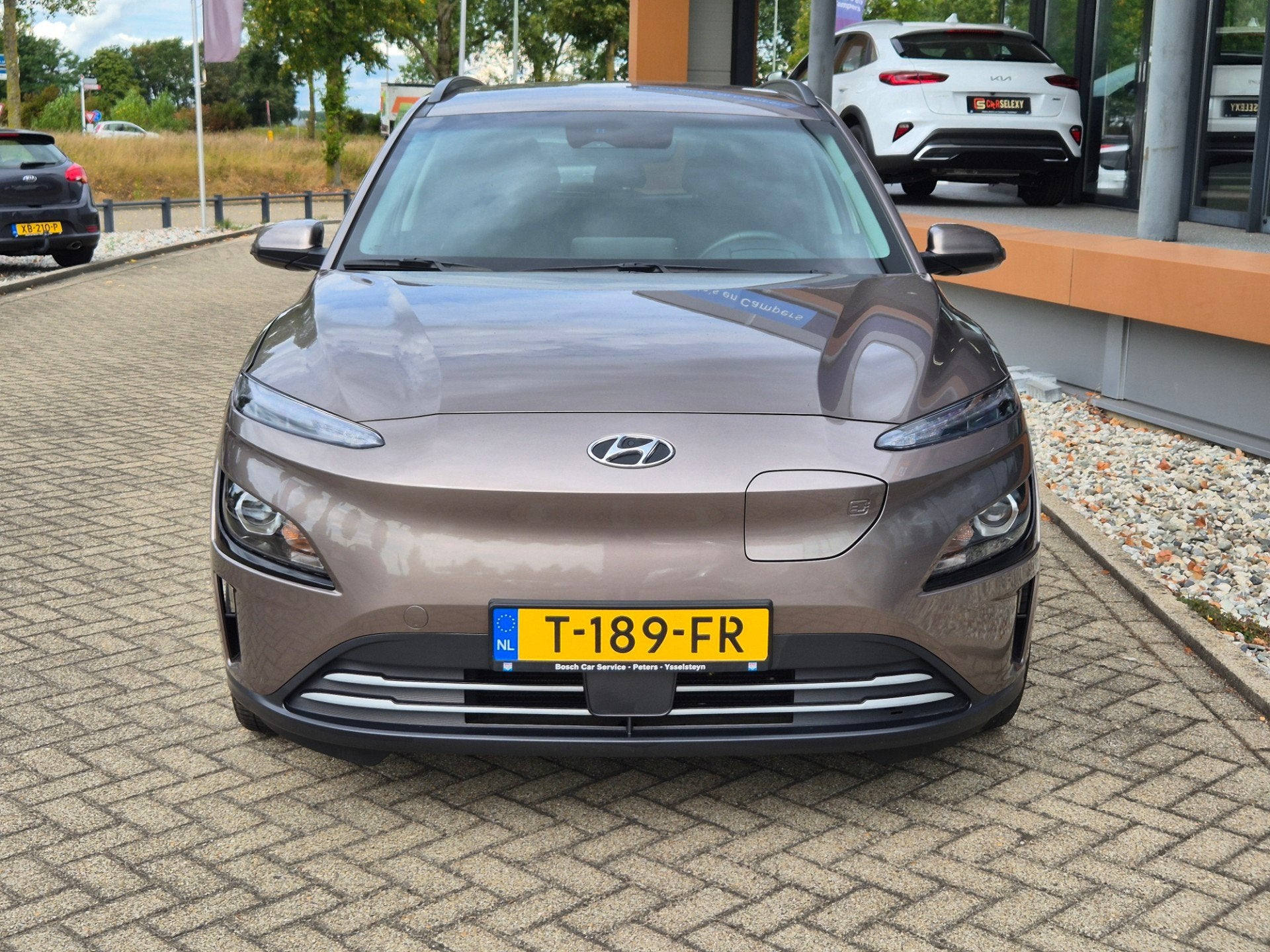 Hyundai Kona EV Fashion 64 kWh / trekhaak, Gebruikt, Bruin, Kona, Automatische klimaatregeling