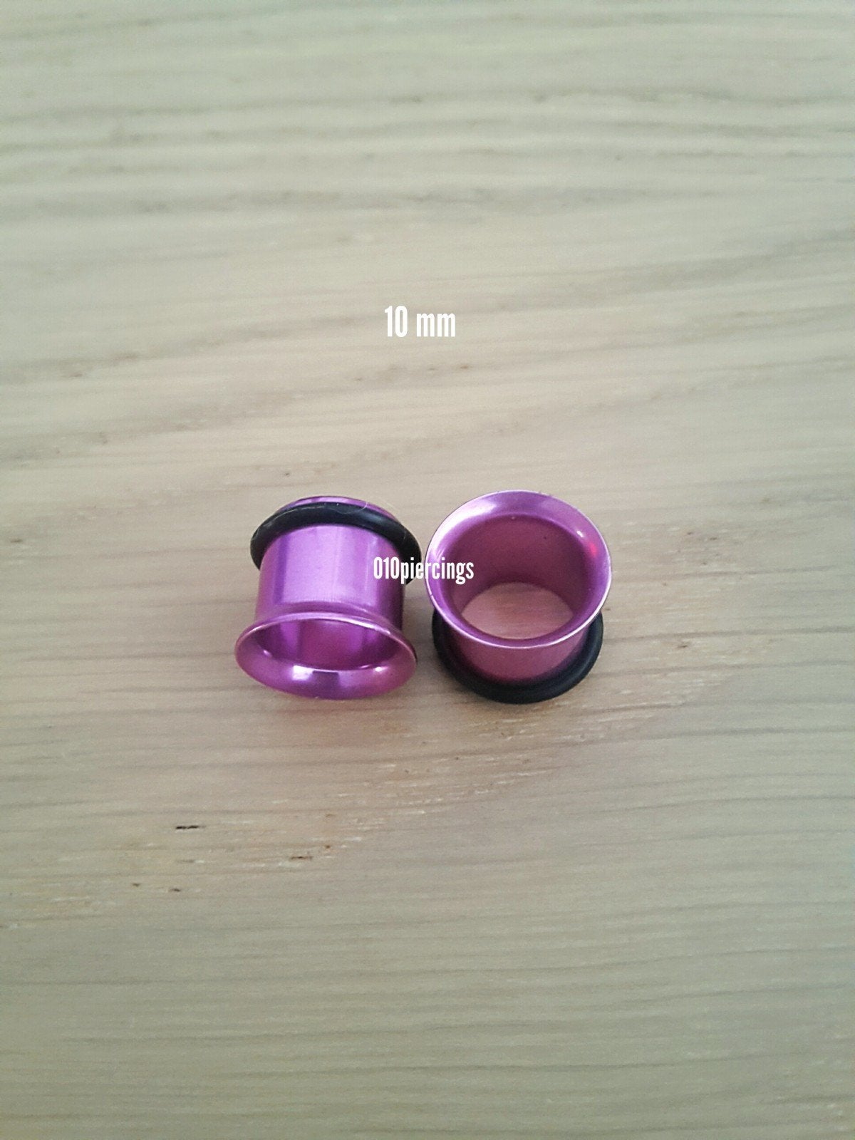 Nieuwe tunnels, pluggen. Staal. Paars. 16 Mm., Ophalen of Verzenden, Zo goed als nieuw, Staal, Oor- of Traguspiercing