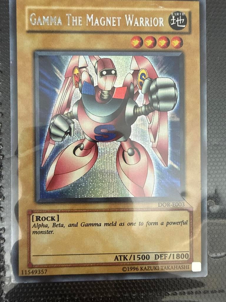 Yu-Gi-Oh! Gamma The Magnet Warrior DOR-E003 Foil, Ophalen of Verzenden, Zo goed als nieuw, Losse kaart, Foil