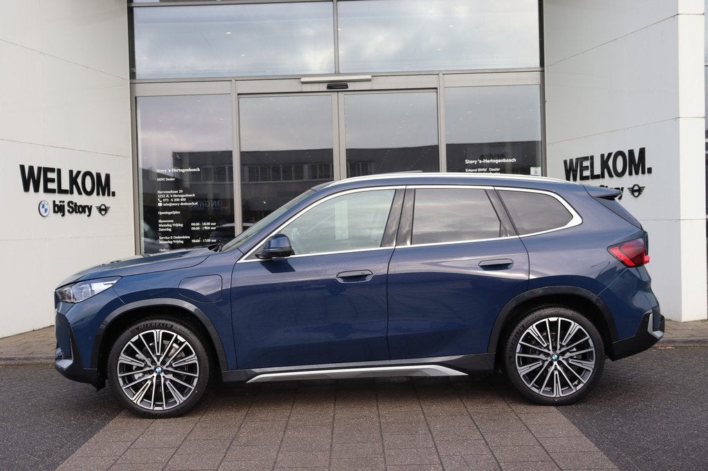 BMW X1 xDrive30e High Executive xLine Automaat / Panoramadak, Auto's, BMW, 1800 kg, Euro 6, Blauw, Leder en Stof