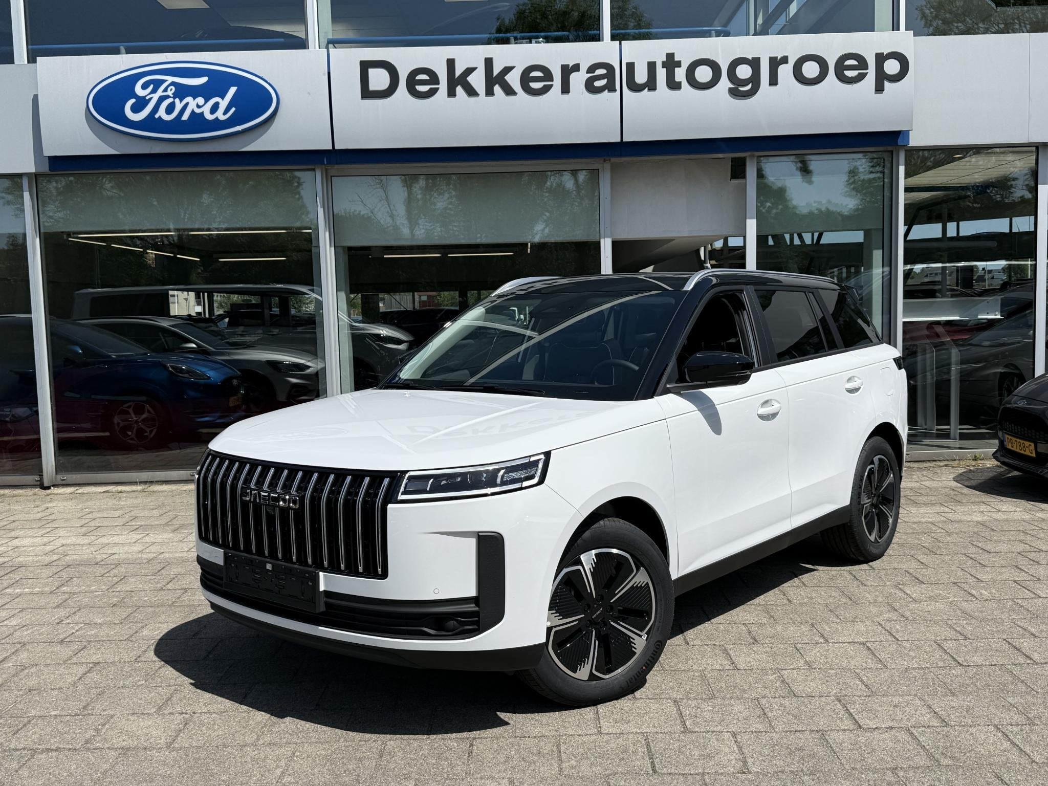 Jaecoo 5 1.5 T-GDi SHS-H Exclusive, Auto's, Gebruikt, 4 cilinders, 2 kWh, Wit