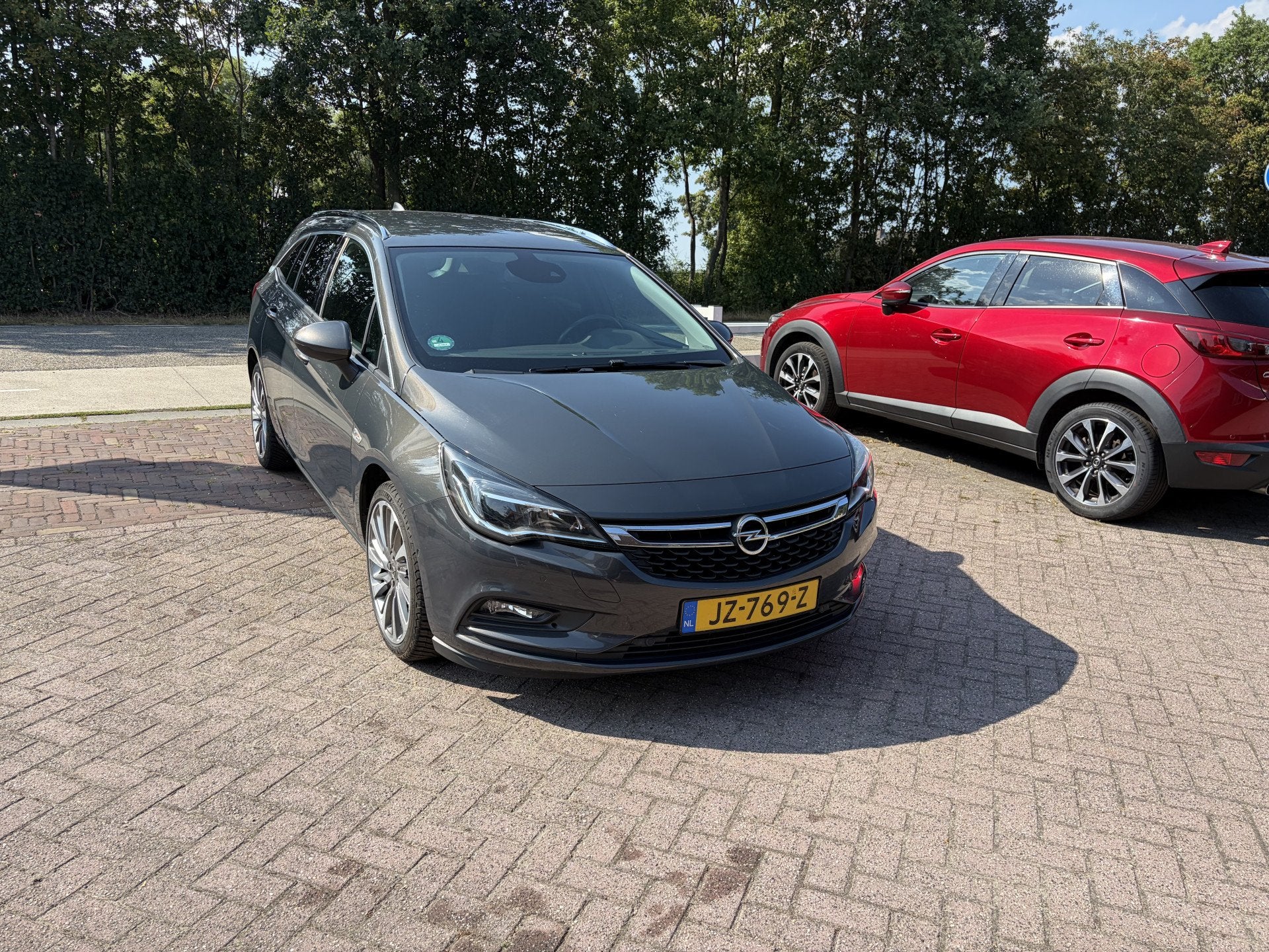 Opel Astra Sports Tourer 1.4 Innovation AUTOMAAT TREKHAAK CL, Gebruikt, 4 cilinders, 150 pk, Leder en Stof