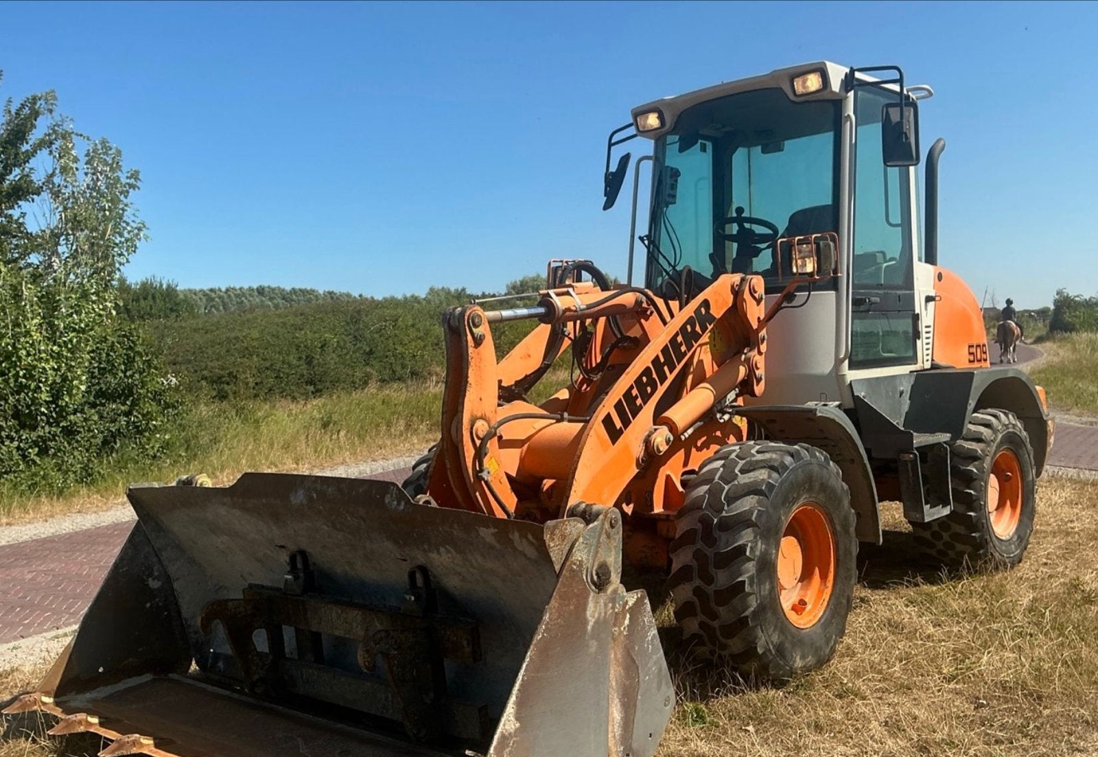 Liebherr L509 Stereo Wiellader - Compact en Krachtig, Ophalen of Verzenden