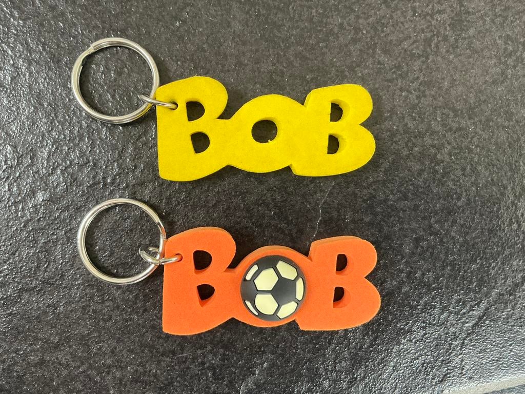 Bob-sleutelhangers: 1 oranje met voetbal WK, 1 geel, Verzamelen, Sleutelhangers, Ophalen, Zo goed als nieuw