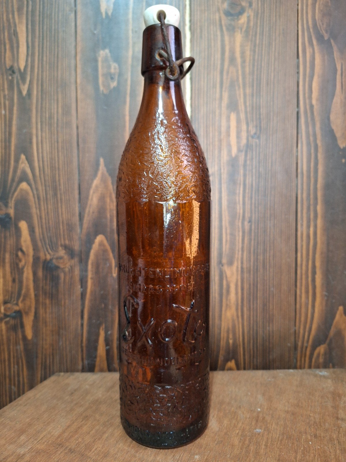 EXOTA RELIËF FLES VRUCHTENLIMONADE GEDEP. HANDELSMERK, Verzamelen, Ophalen of Verzenden, Gebruikt, Flesje(s), Overige merken