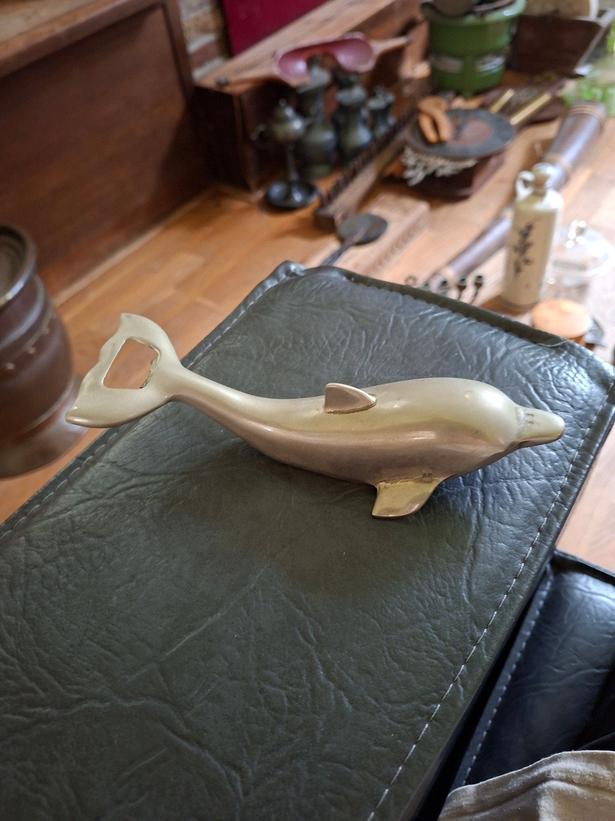 Vintage dolfijn flesopener, Ophalen