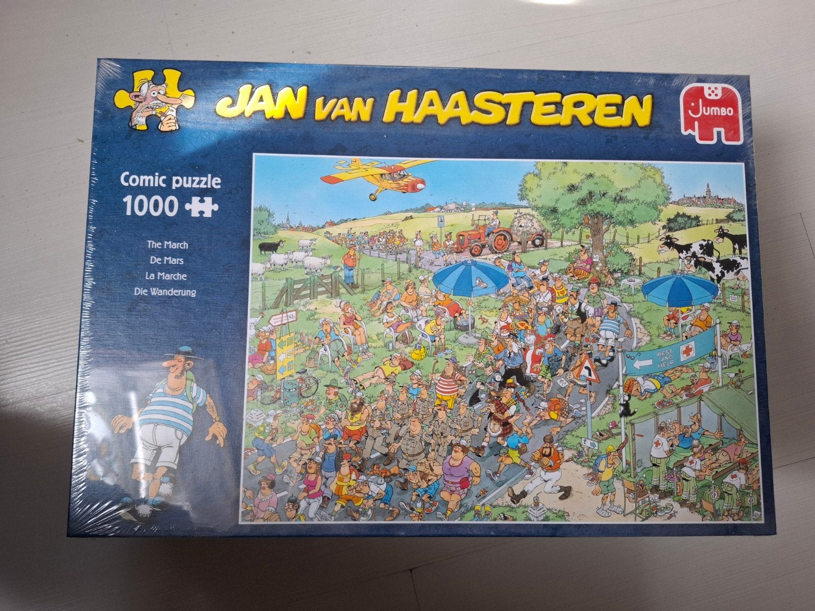 Jan van Haasteren Comic Puzzel - De Mars (1000 stukjes), Ophalen, 500 t/m 1500 stukjes, Nieuw, Legpuzzel
