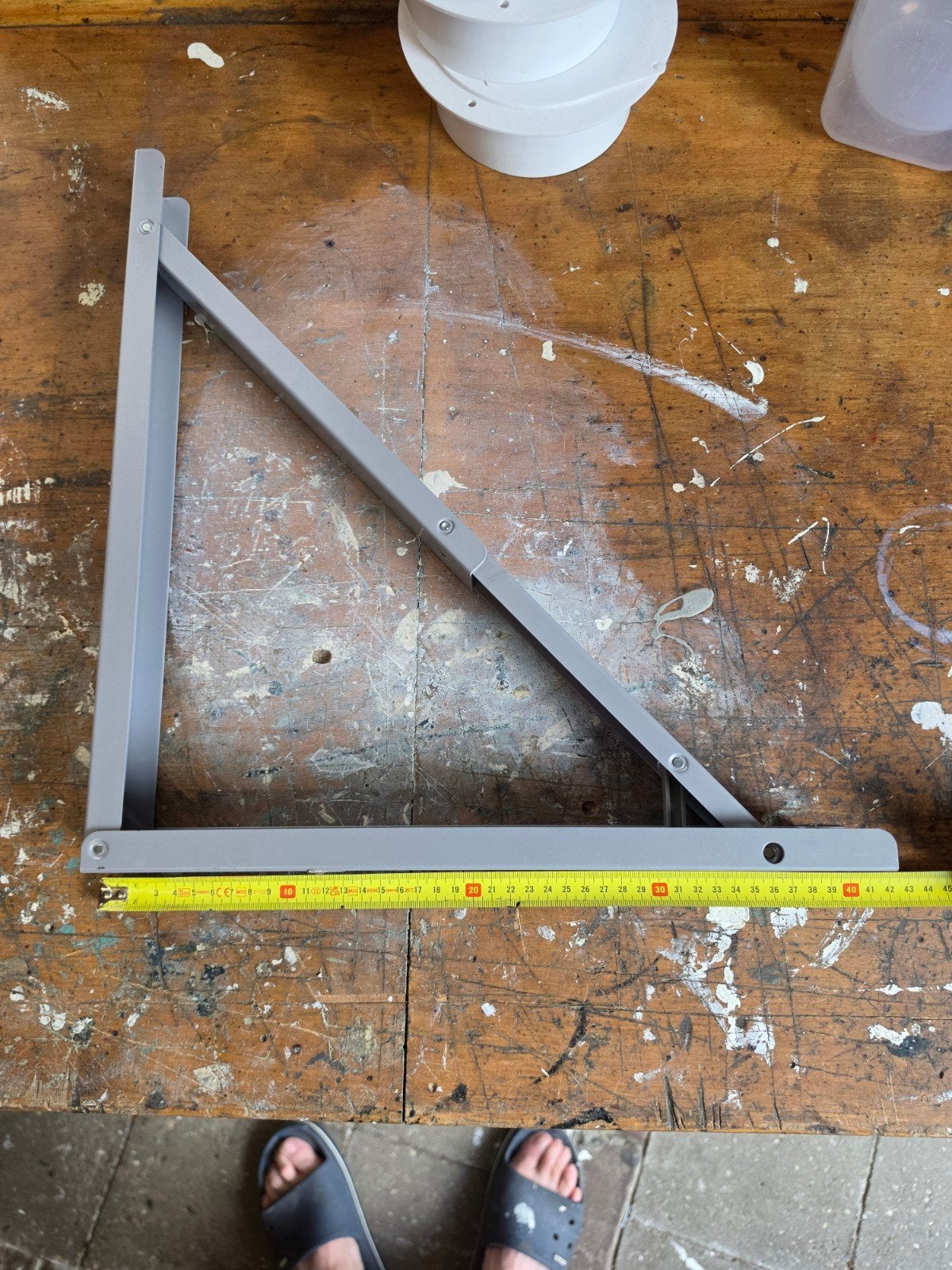 Inklapbare plankdrager - Grijs metaal, Doe-het-zelf en Verbouw, Ophalen of Verzenden, Gebruikt, Minder dan 70 cm, Inklapbaar