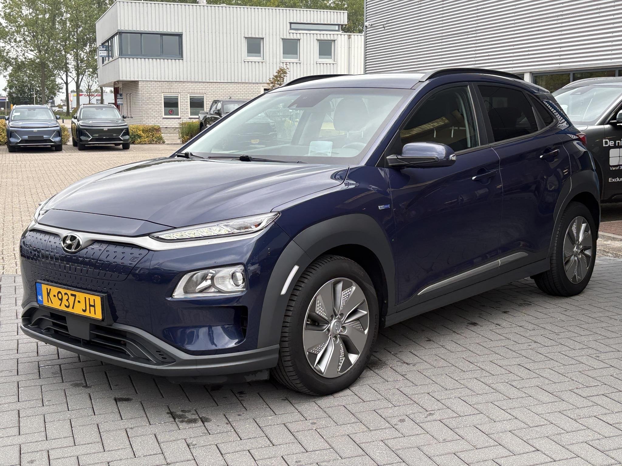 Hyundai Kona EV Fashion 64 kWh | SOH 100% | Head-up Display, Stof, Gebruikt, Blauw, Origineel Nederlands