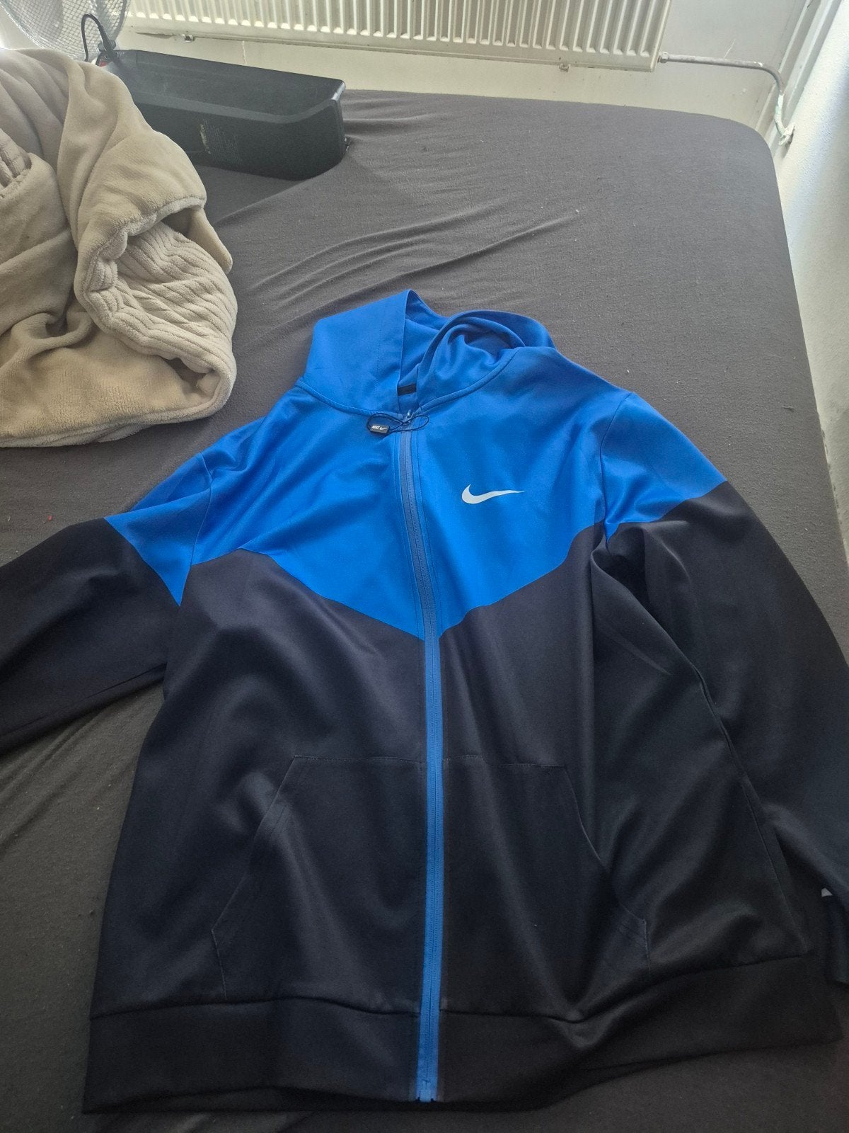 Nike trainingsjack blauw/zwart - Zo goed als nieuw, Ophalen, Blauw, Nike, Overige maten