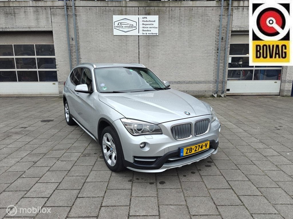 BMW X1 xDrive28i 245PK 2014 AUT/CRUISE/PDC/LMV/XENON/LUXE!, Auto's, BMW, Gebruikt, 4 cilinders, 2000 kg, Leder en Stof