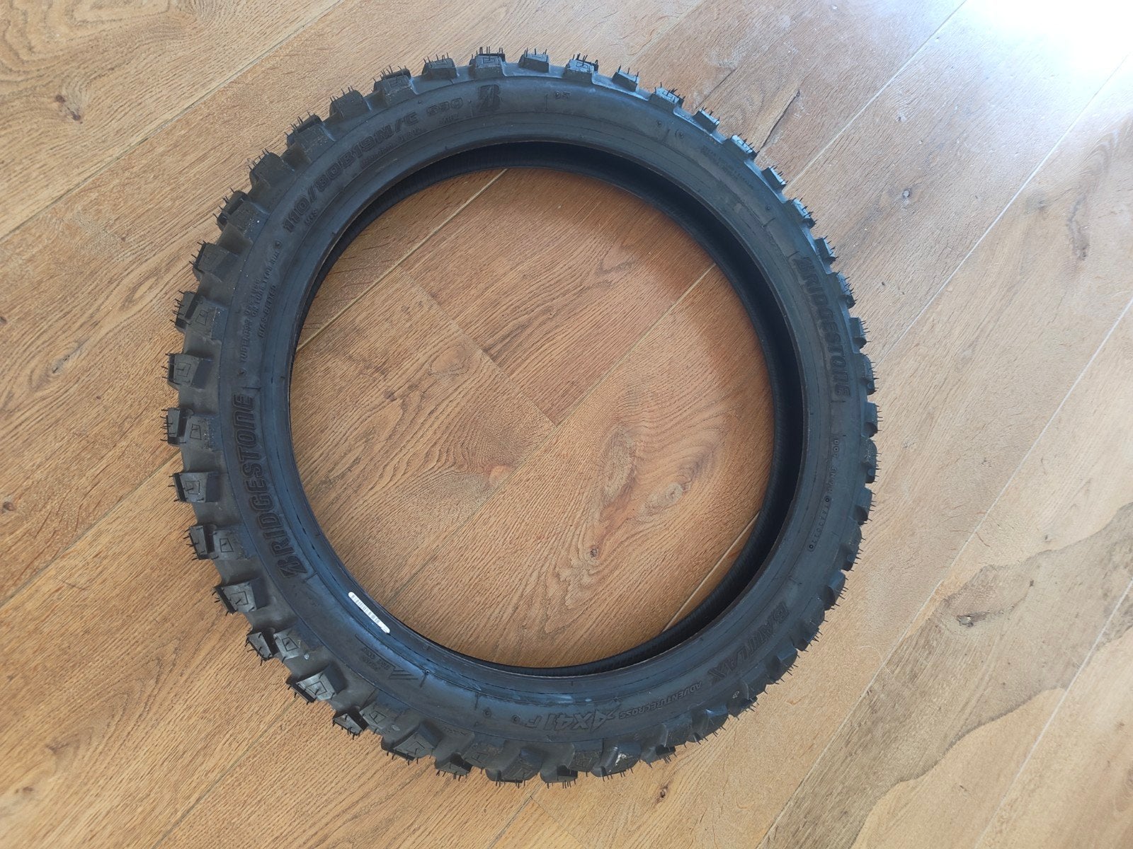 Nieuwe Bridgestone Adventurecross AX41 DOT22 110/80/19, Ophalen, Nieuw
