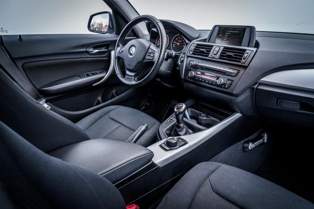 BMW 1-serie 116i Business | Airco | Xenon | Professional rad, Auto's, BMW, Euro 5, Gebruikt, 4 cilinders, Blauw