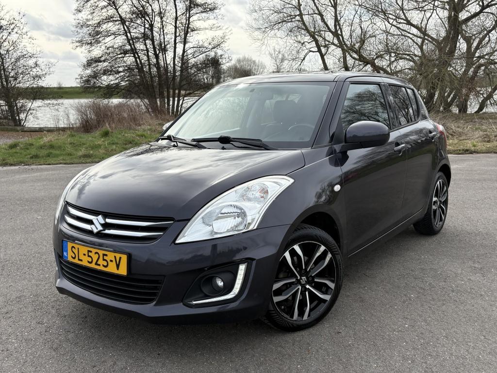 Suzuki Swift 1.2 Exclusive EASSS Stoelverw Cruise Carplay Ai, Auto's, Suzuki, Voorwielaandrijving, Gebruikt, 4 cilinders, 400 kg