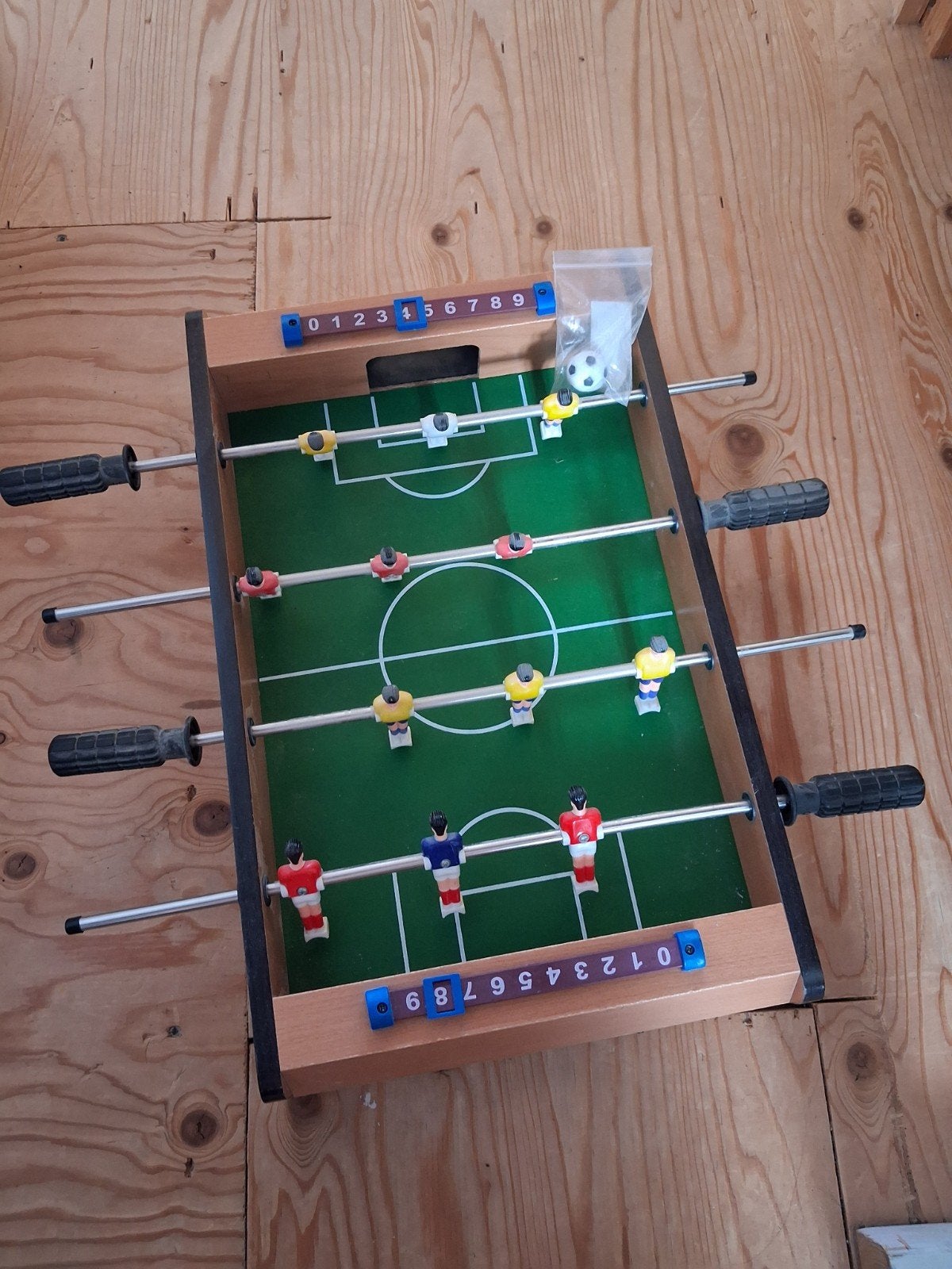 Tafelvoetbalspel voor op tafel, Ophalen