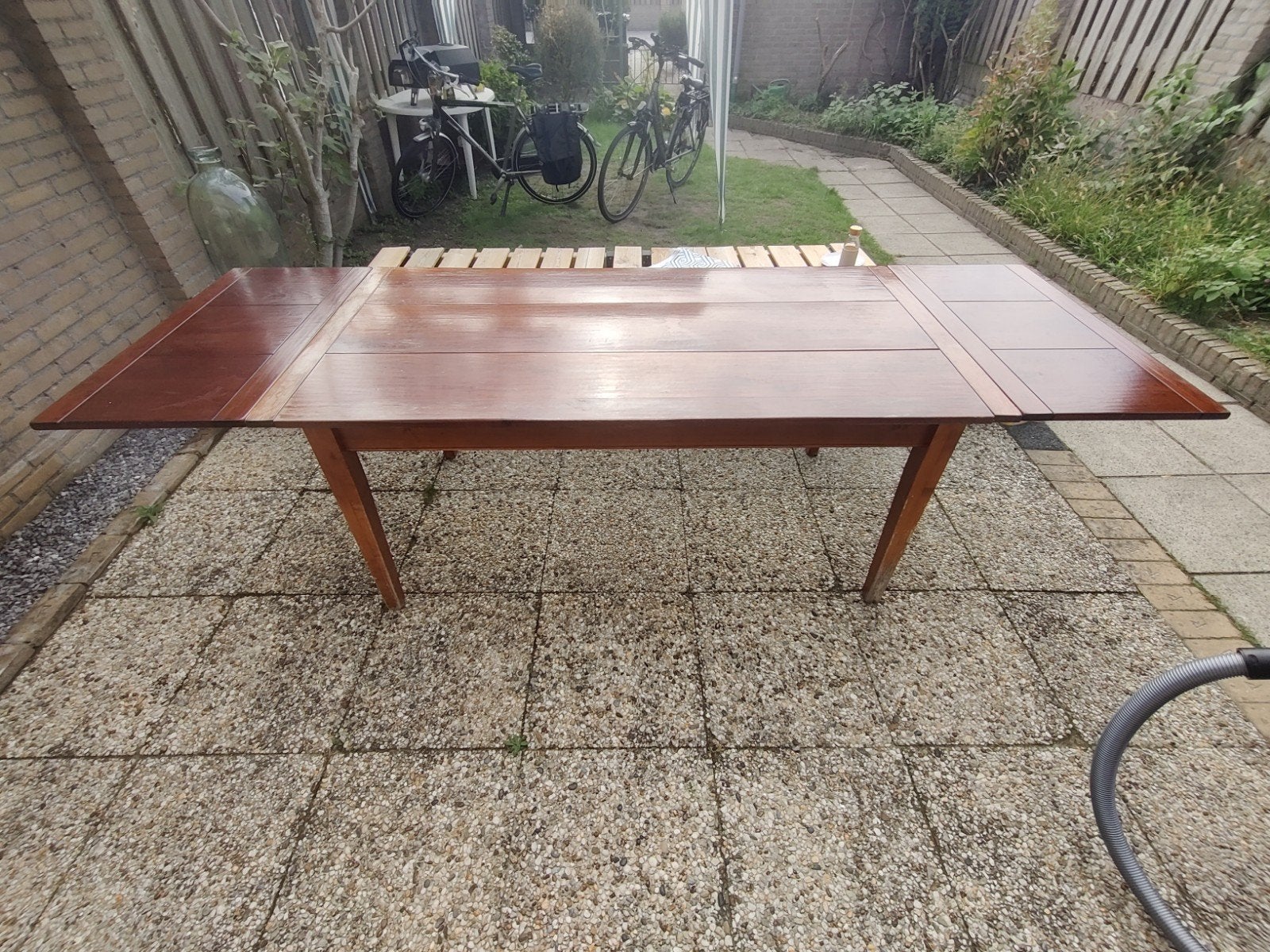 Uitschuifbare houten eettafel met lade (timmerman), Ophalen