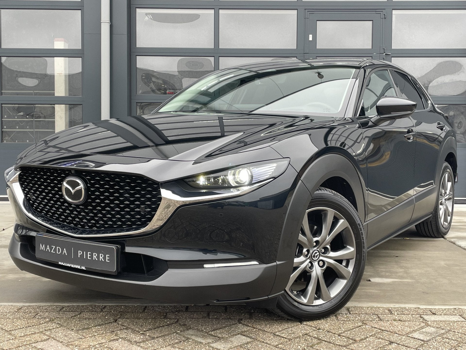 Mazda CX-30 2.0 e-SkyActiv-X 186 M Hybrid Automaat Exclusive, Auto's, Stof, Gebruikt, Overige brandstoffen, Zwart