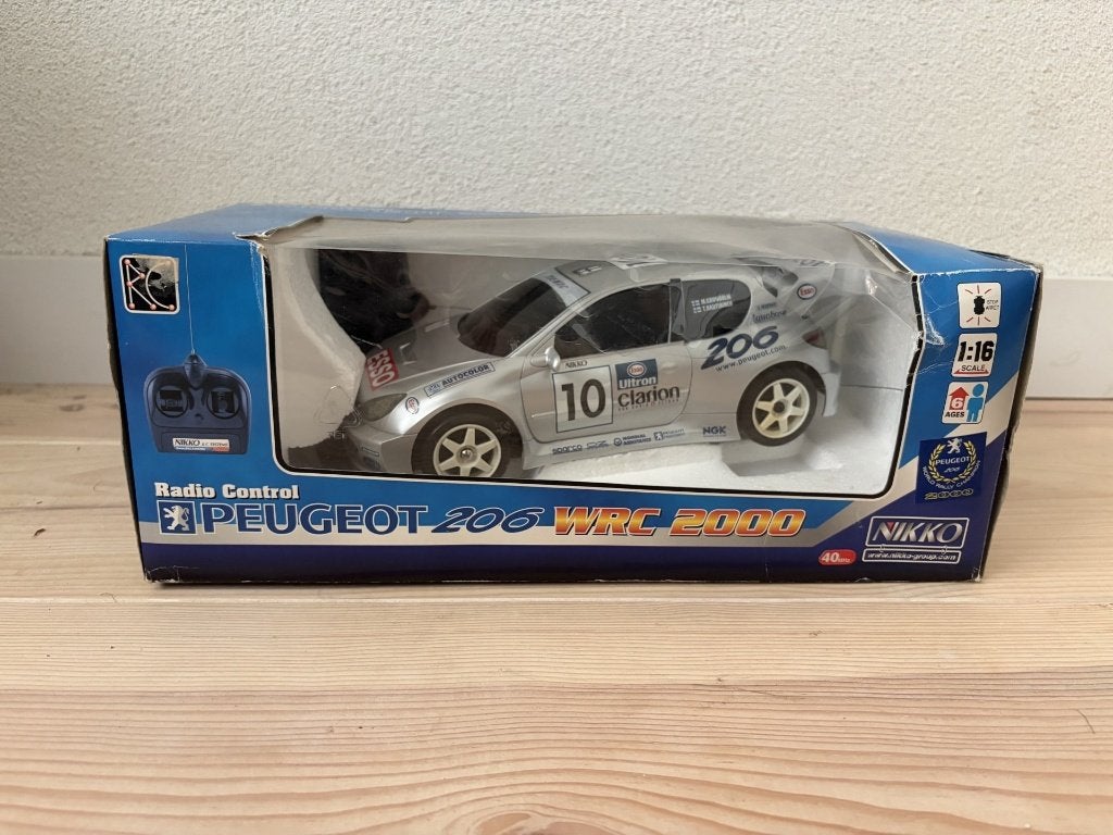 Nikko Peugeot 206 radiobestuurbare auto, Hobby en Vrije tijd, Modelbouw | Radiografisch | Auto's, Elektro, Gebruikt, Ophalen of Verzenden