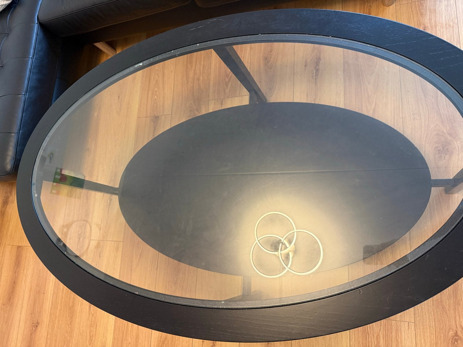 Ovale salontafel met glazen blad en opbergruimte, Ophalen, Gebruikt, 100 tot 150 cm, 50 tot 100 cm
