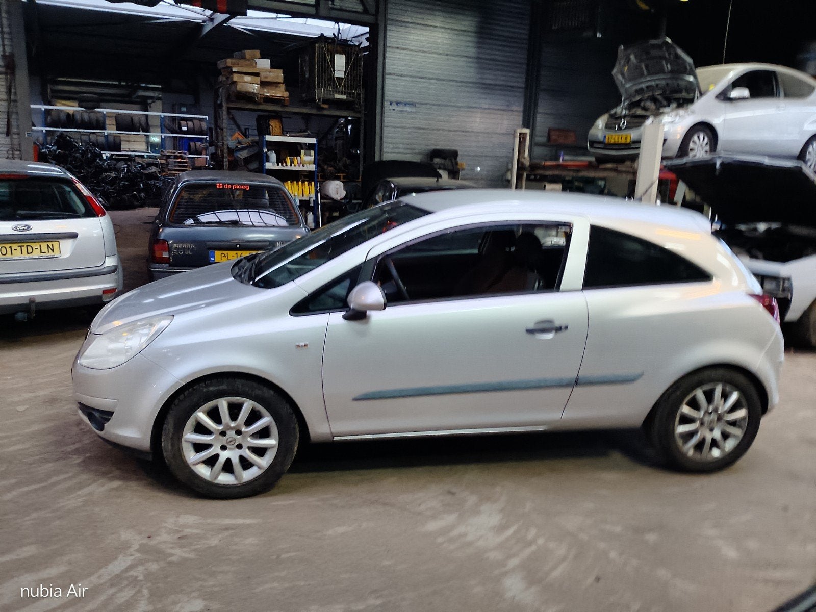 Opel Corsa 1.0 12V 3D 2007 Grijs met nw. apk, Auto's, Voorwielaandrijving, Metallic lak, 40 €/maand, Zwart