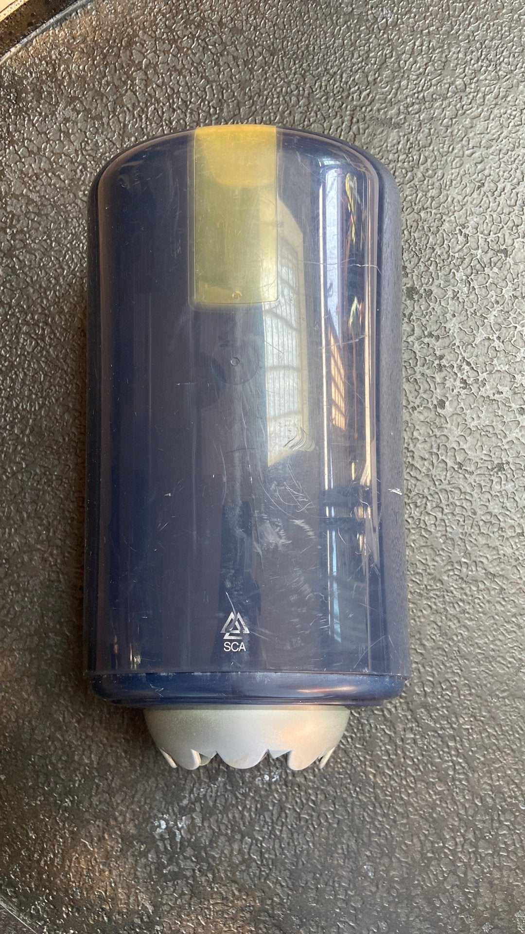 Tork mini papierrolhouder, Ophalen