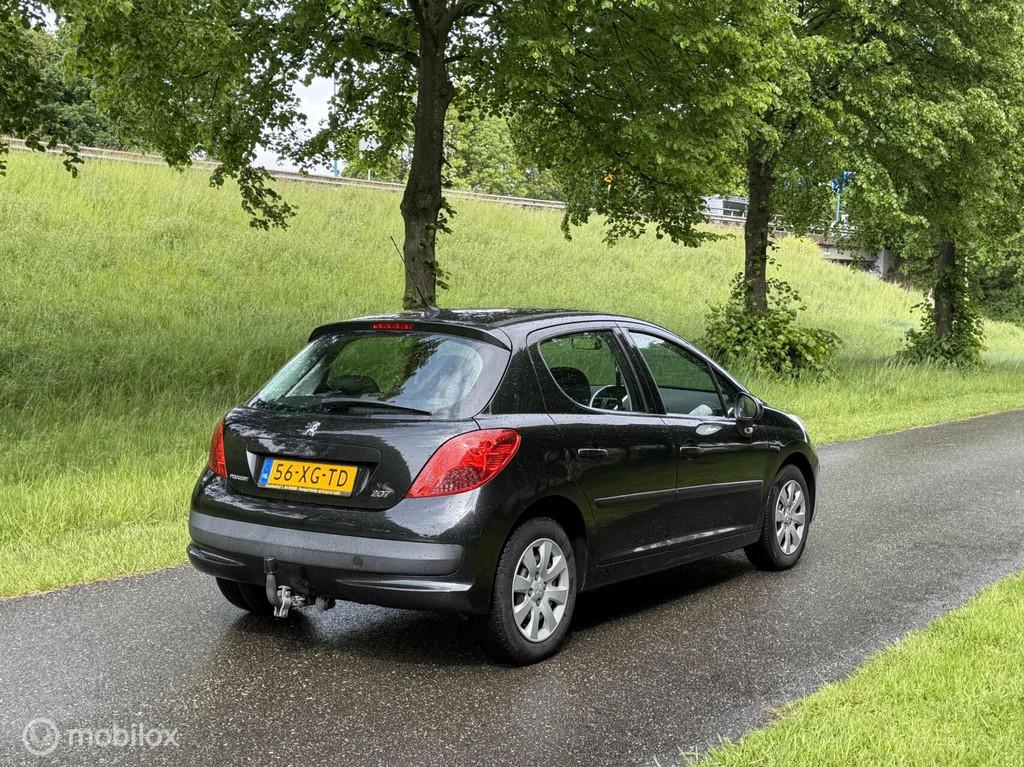 Peugeot 207 1.4 Color-line*1E EIGENAAR*NEW APK*AIRCO*TREKHAA, Auto's, Voorwielaandrijving, Stof, Zwart, 4 cilinders