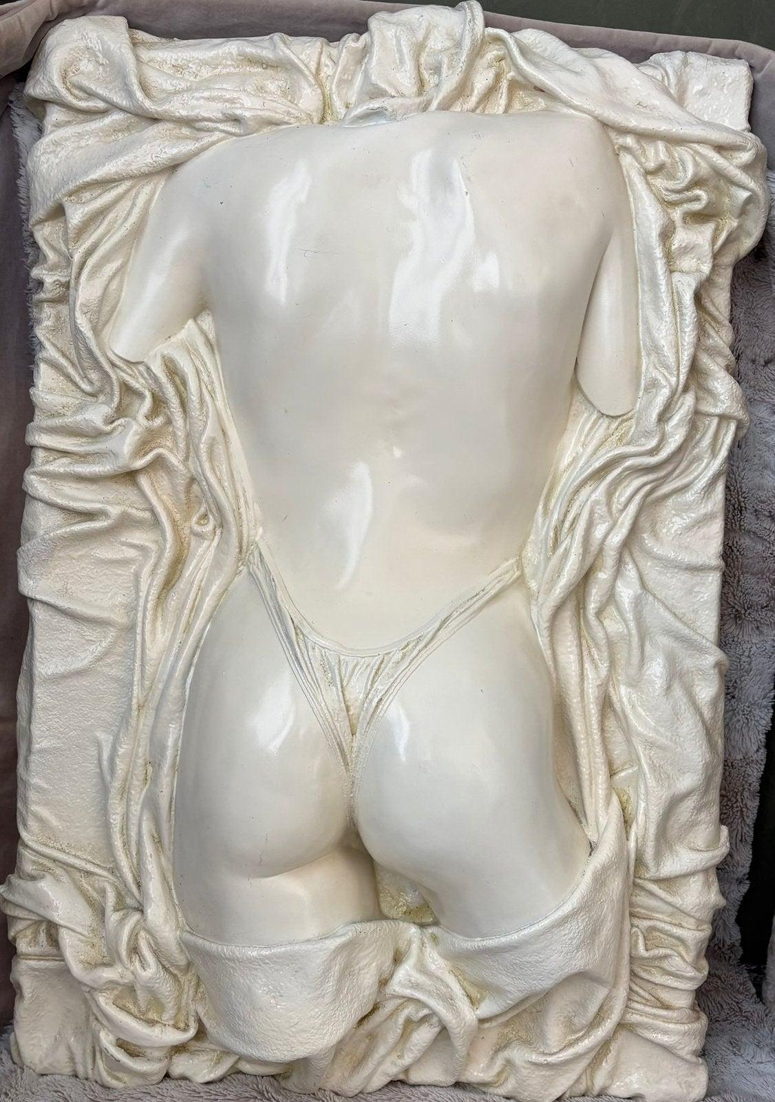 Torso achterzijde, Ophalen