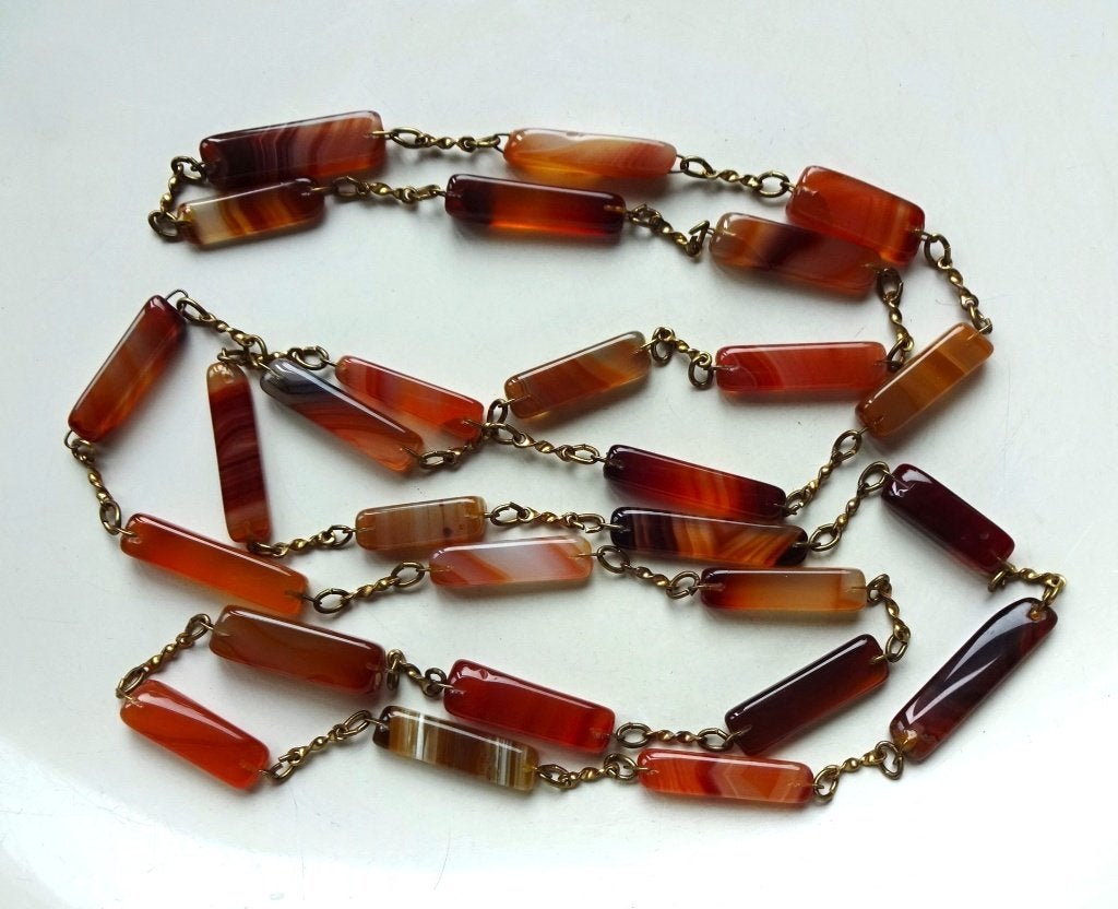 Lange vintage ketting: Schotse bandagaat, roodbruin, Ophalen of Verzenden, Koper, Ketting, Met edelsteen