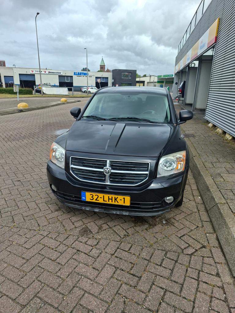 Dodge Caliber 2.0 2010 Zwart, Auto's, Dodge, 1998 cc, 450 kg, Zwart, Origineel Nederlands