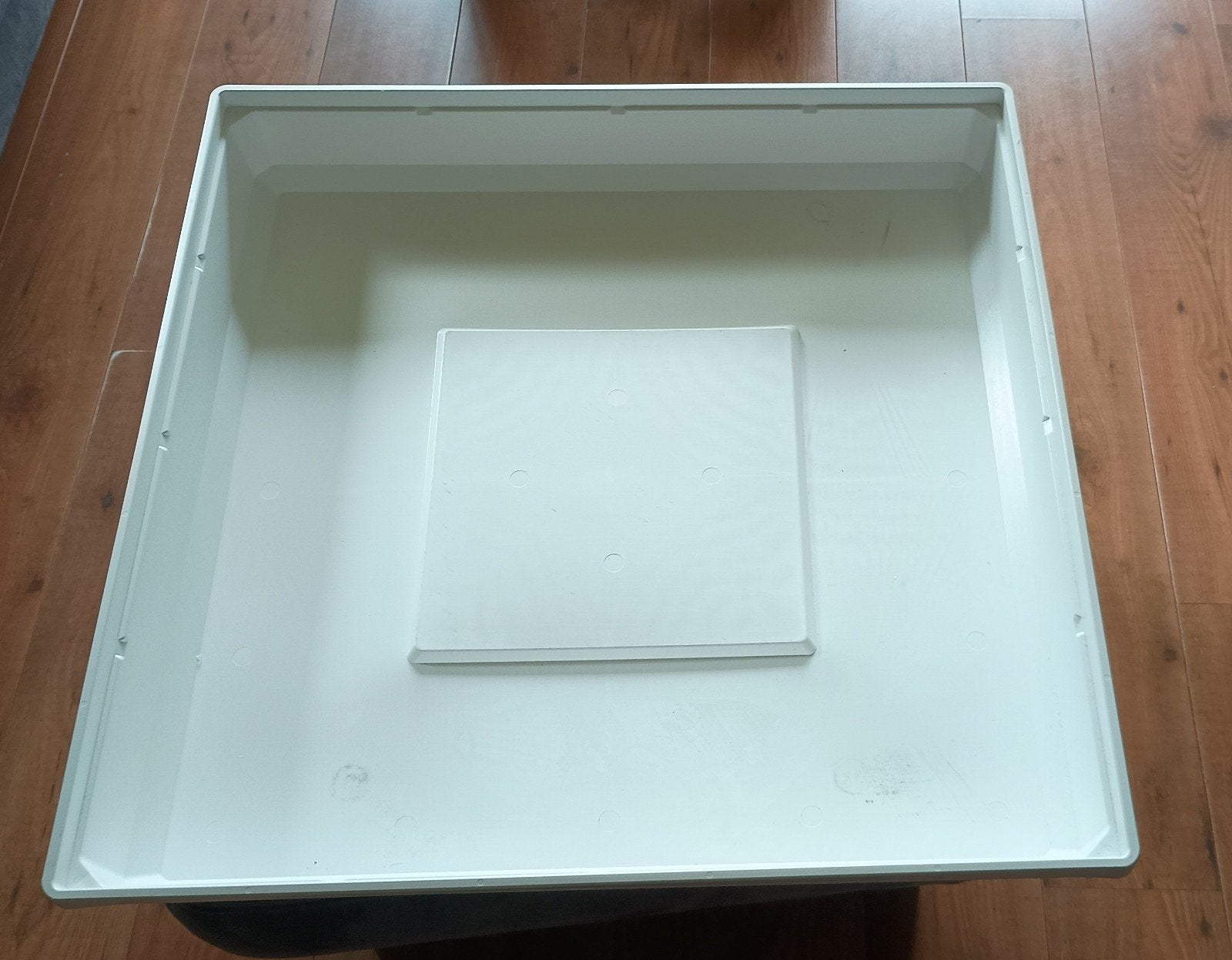 Lekbak voor wasmachine, Ophalen