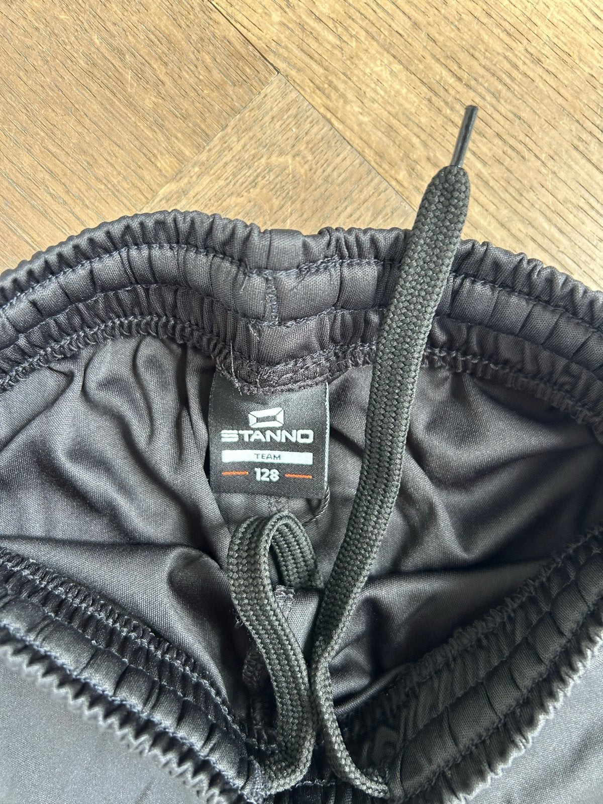 PVC Stanno Field Short Zwart Maat 128 - Nieuw, Ophalen, Nieuw, Jongen of Meisje, Sport- of Zwemkleding