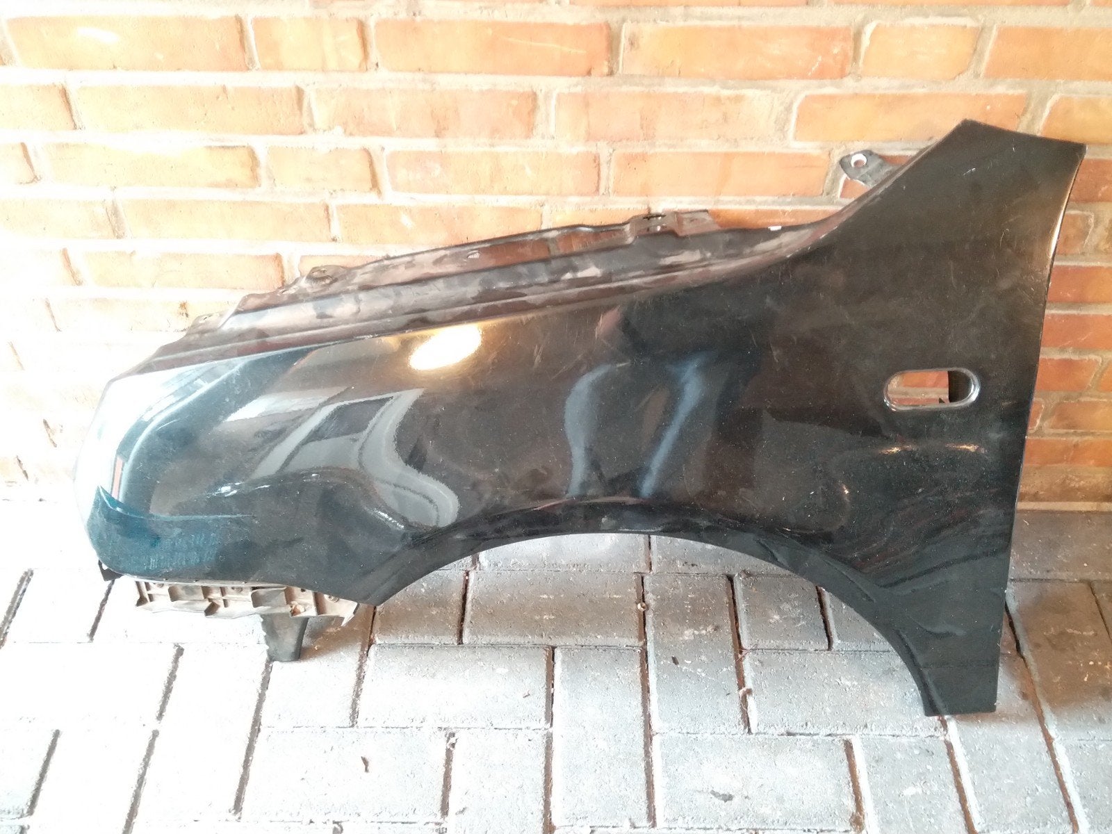 VW Lupo 3L spatbord linksvoor – origineel & netjes in zwart, Gebruikt, Ophalen of Verzenden, Spatbord, Volkswagen