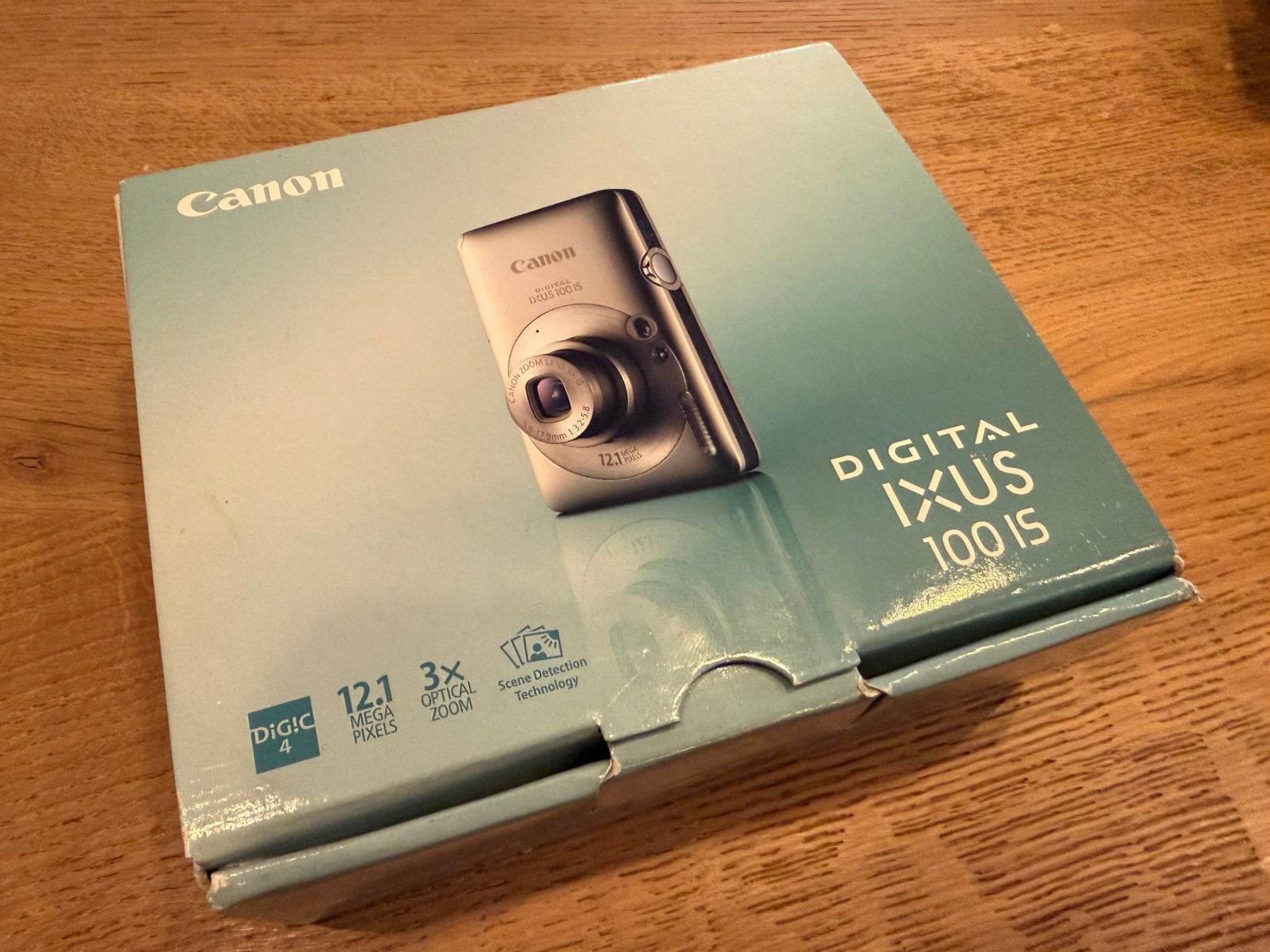 Teab: Canon digital Ixus 100 met 1Gb kaartje en leren hoes, Accu, Canon, 12 megapixels, Ophalen of Verzenden
