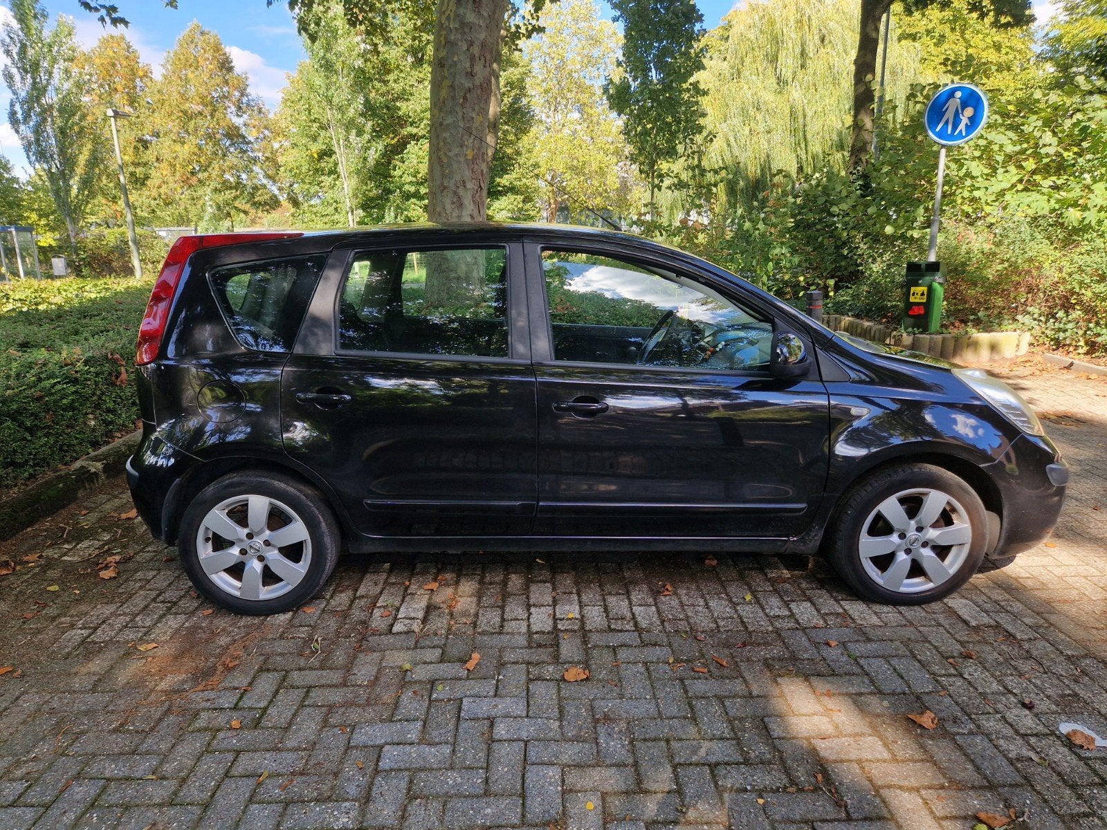 Nissan Note 1.4 16V 2007 Zwart, Auto's, Voorwielaandrijving, 40 €/maand, 4 cilinders, Zwart