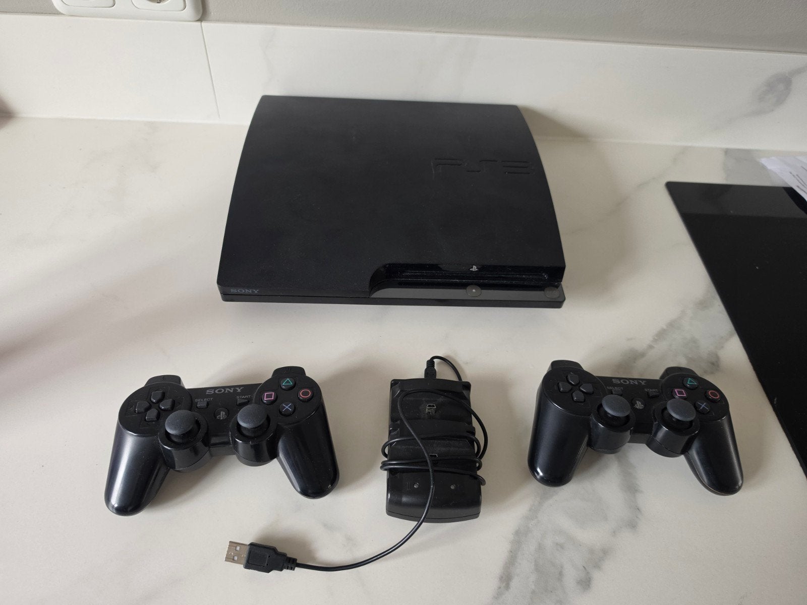 PlayStation 3 met 2 controllers en 12 spellen