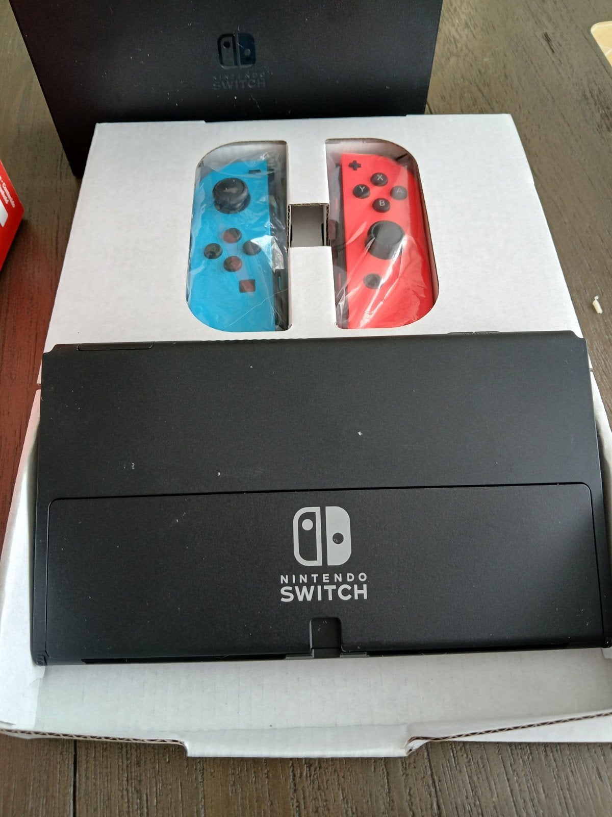 Foto 4 van Nintendo Switch OLED met 3 games en accessoires