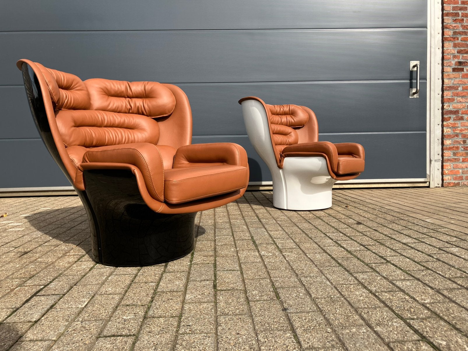 2x Joe Colombo Elda Chair Cognac leather, White/Black Shell, Huis en Inrichting, Fauteuils, Ophalen of Verzenden