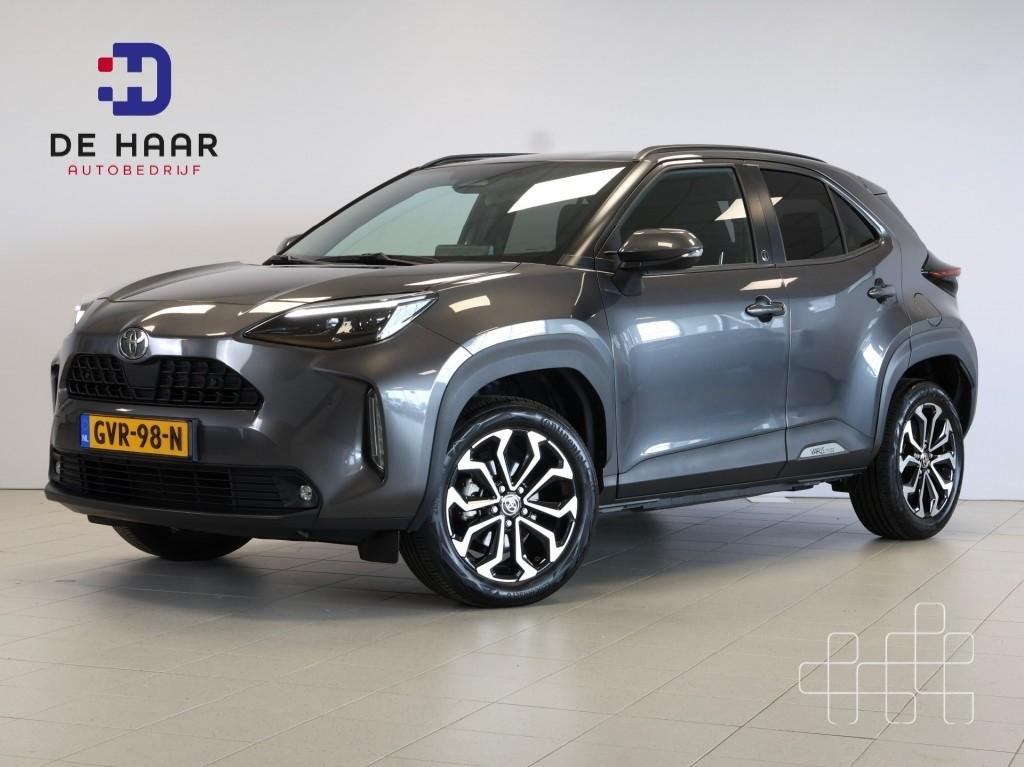 Toyota YARIS CROSS 1.5 Hybrid 130 Dynamic - Stoel/Stuurverw., Auto's, Gebruikt, 750 kg, Met garantie (alle), 1490 cc