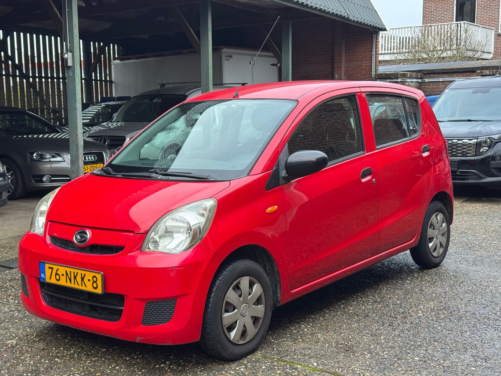 Daihatsu Cuore 1.0 5D 2010 Rood 231.000km NAP +nieuwe APK, Voorwielaandrijving, 600 kg, 18 €/maand, 4 stoelen
